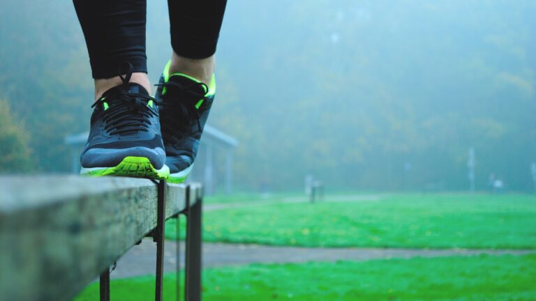 Girl balancing in her sneakers on a ledge outside outdoor recreation stability balance stable