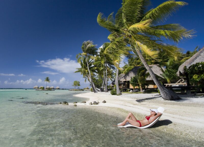 Sunbathing on a tropical beach in French Polynesia