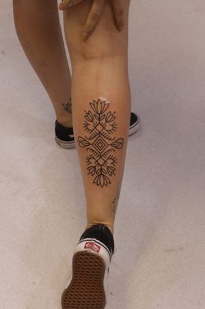 female calf tattoo