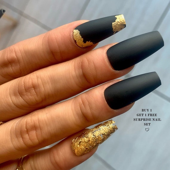 Black With Gold Decorated Nails