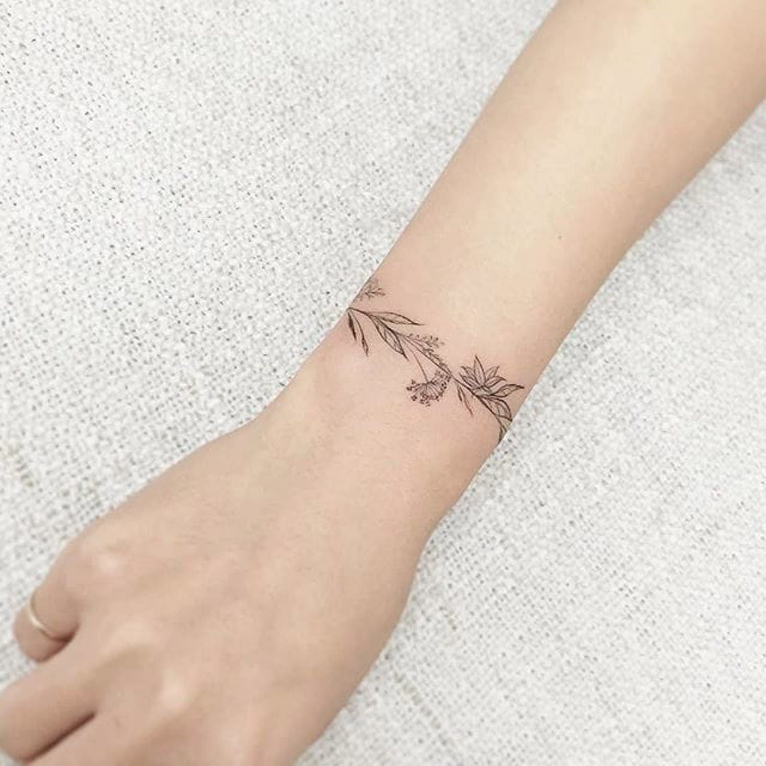 female bracelet tattoo