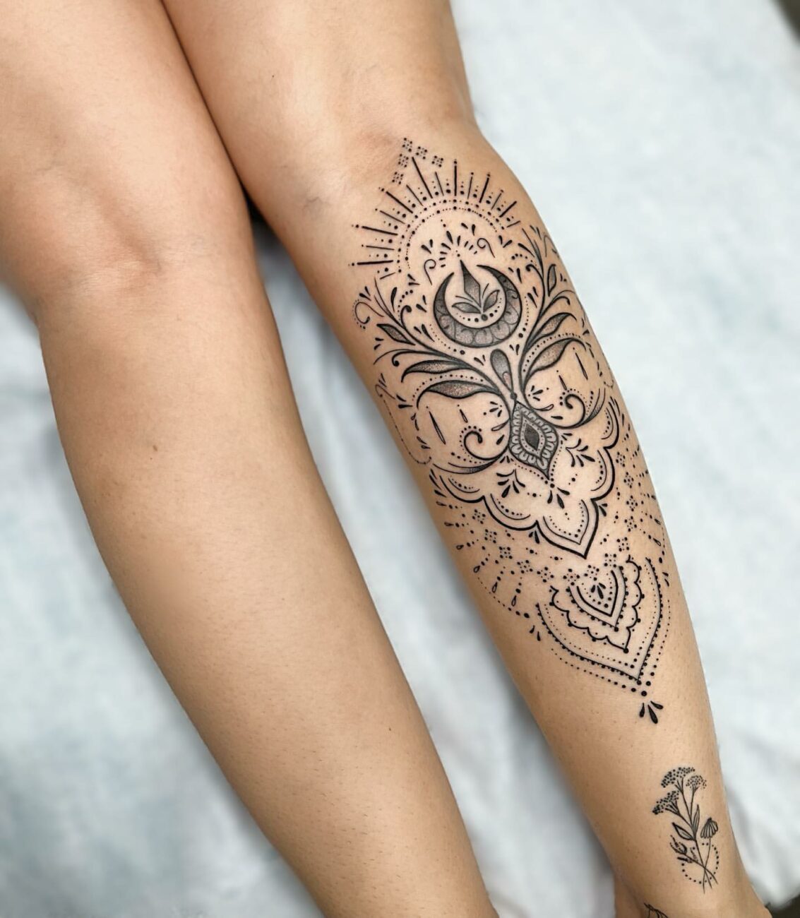 female calf tattoo