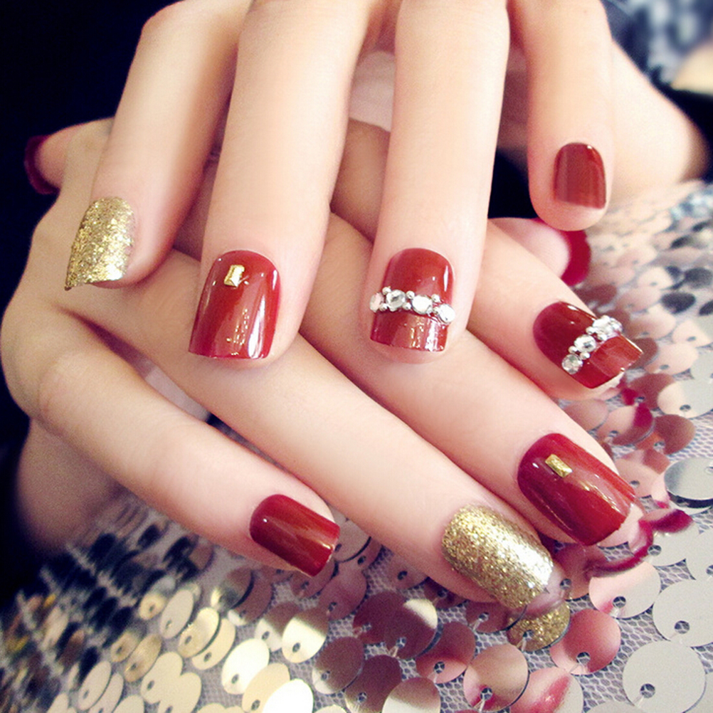 Red And Gold Decorated Nail