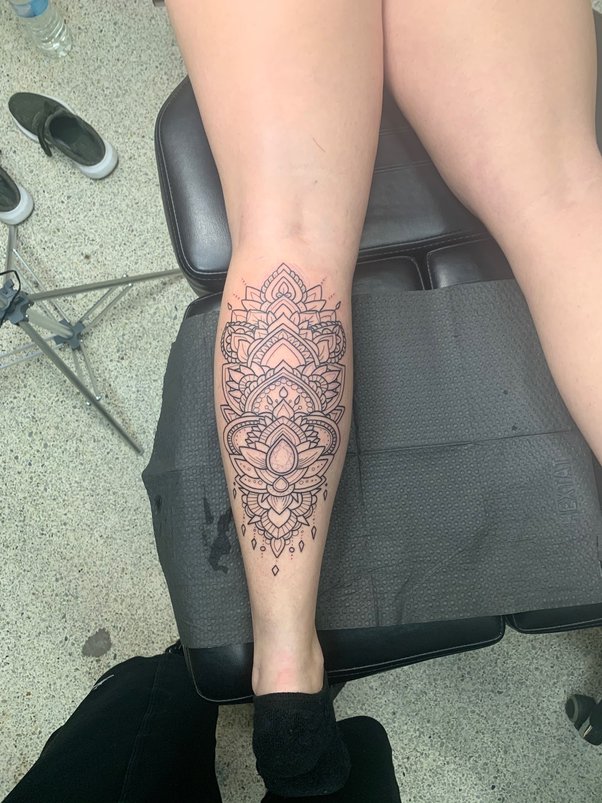 female calf tattoo