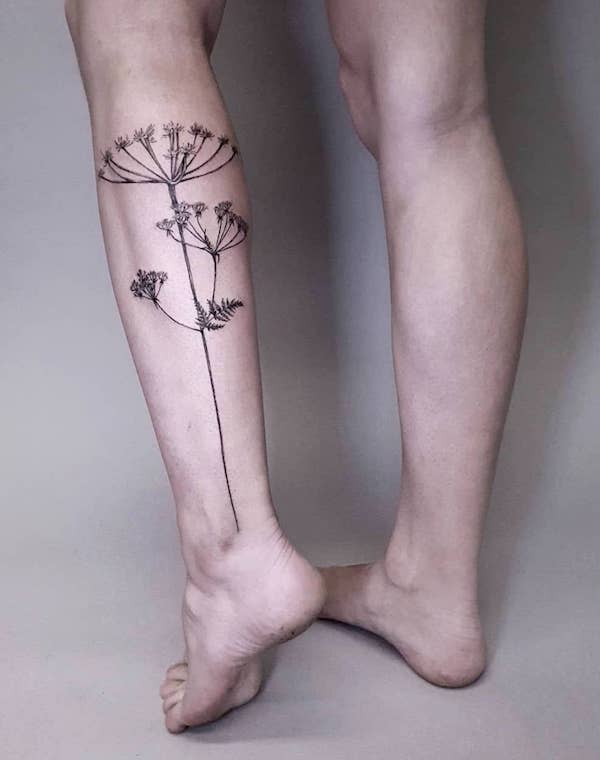 female calf tattoo