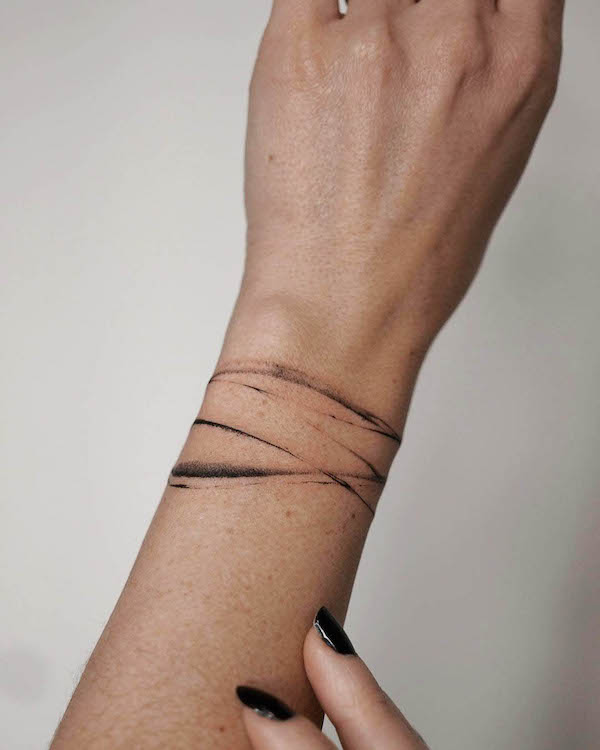 female bracelet tattoo