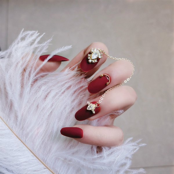 Red And Gold Decorated Nail