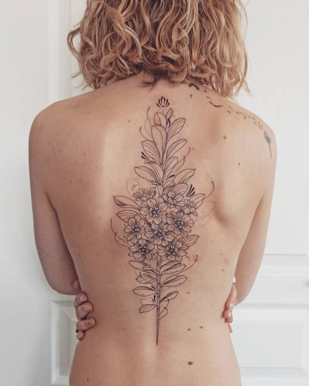 Female tattoo on the back