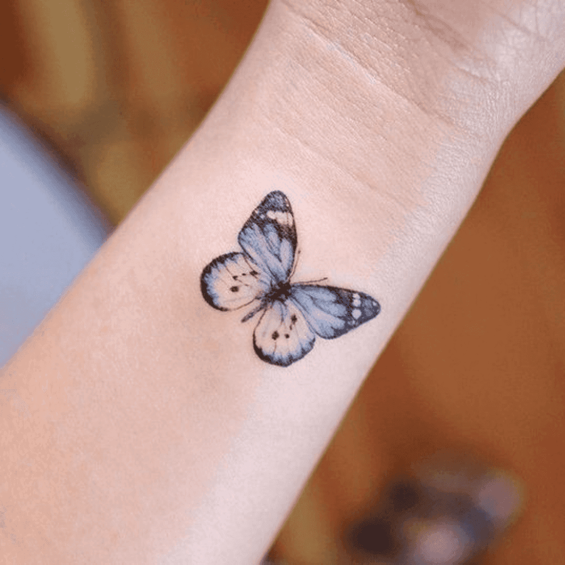 Tatuagem de Borboleta no Braço Delicada